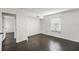 Bright bedroom with dark hardwood floors and an open door at 4832 Cobia Se Dr # B, St Petersburg, FL 33705