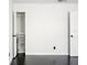 Well-lit bedroom with dark hardwood floors and walk-in closet at 4832 Cobia Se Dr # B, St Petersburg, FL 33705