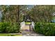 White footbridge walkway through lush landscaping at 4832 Cobia Se Dr # B, St Petersburg, FL 33705