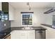 Modern kitchen with stainless steel appliances and granite counters at 4832 Cobia Se Dr # B, St Petersburg, FL 33705