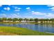 Picturesque lakefront view with a fountain and homes at 4832 Cobia Se Dr # B, St Petersburg, FL 33705