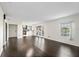 Spacious living room with dark hardwood floors and access to patio at 4832 Cobia Se Dr # B, St Petersburg, FL 33705