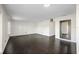 Bright living room with dark hardwood floors and an open floor plan at 4832 Cobia Se Dr # B, St Petersburg, FL 33705