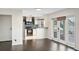 Living room with dark hardwood floors and access to patio at 4832 Cobia Se Dr # B, St Petersburg, FL 33705