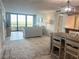 Bright living room with water views and access to balcony at 5701 Mariner St # 502, Tampa, FL 33609