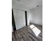 Spacious bedroom with wood-look floors and large closet at 5714 Olive Dr, New Port Richey, FL 34652