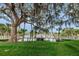 Scenic view of a picturesque community park with wooden bridge and Spanish moss-draped trees at 5714 Olive Dr, New Port Richey, FL 34652
