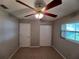 Bright bedroom with window and ceiling fan at 5705 103Rd N Ter, Pinellas Park, FL 33782