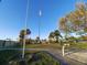 Tall flagpole with American flag in a park setting at 5705 103Rd N Ter, Pinellas Park, FL 33782