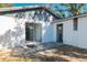 Rear view of house with sliding glass doors at 9102 Post Oak Ct, Tampa, FL 33615