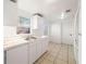 Efficient kitchen with white cabinets and tiled floors at 9102 Post Oak Ct, Tampa, FL 33615