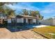 House exterior with a gray and white color scheme at 9102 Post Oak Ct, Tampa, FL 33615