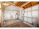 Unfinished workshop with shelves and water heater at 9102 Post Oak Ct, Tampa, FL 33615