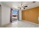 Bedroom with tiled floors, window, and ceiling fan at 9102 Post Oak Ct, Tampa, FL 33615