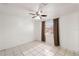 Bedroom with tiled floors, window, and ceiling fan at 9102 Post Oak Ct, Tampa, FL 33615