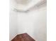 Empty closet with wooden floors and shelving at 9102 Post Oak Ct, Tampa, FL 33615