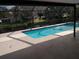 Inviting screened pool with spa and lake view at 1291 S Disston Ave, Tarpon Springs, FL 34689