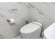 Modern bathroom with marble tile and a smart toilet at 1390 Gulf Blvd # 1204, Clearwater, FL 33767