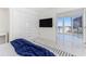 Bright bedroom with water view, large closet, and plush bedding at 1390 Gulf Blvd # 1204, Clearwater, FL 33767