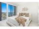 Bedroom with water view and luxurious bedding at 1390 Gulf Blvd # 1204, Clearwater, FL 33767