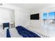 Bright bedroom with water view, large closet, and plush bedding at 1390 Gulf Blvd # 1204, Clearwater, FL 33767