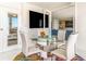 Bright dining area with glass table and ocean view at 1390 Gulf Blvd # 1204, Clearwater, FL 33767