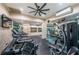 Home gym with treadmills, exercise equipment, mirrors and TV at 1390 Gulf Blvd # 1204, Clearwater, FL 33767