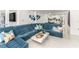 Modern living room with sectional sofa and view of kitchen at 1390 Gulf Blvd # 1204, Clearwater, FL 33767