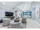 Open concept living room featuring modern furnishings and decor adjacent to dining and kitchen area at 1390 Gulf Blvd # 1204, Clearwater, FL 33767
