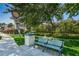 Inviting walkway with a bench and lush greenery, perfect for a leisurely stroll at 1390 Gulf Blvd # 1204, Clearwater, FL 33767