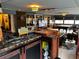 Game room with bar, pool table, and various games at 14492 Tanglewood N Dr, Largo, FL 33774