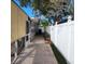 Side yard with brick pavers and privacy fence at 14492 Tanglewood N Dr, Largo, FL 33774