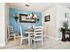 Charming dining room with round table and white chairs at 1687 Starling Drive, Tarpon Springs, FL 34689