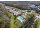 Community pool with surrounding green space and buildings at 1687 Starling Drive, Tarpon Springs, FL 34689