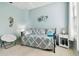 Bedroom with daybed, seating and coastal decor at 1687 Starling Drive, Tarpon Springs, FL 34689