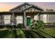 Charming house with green door and landscaped yard at 1687 Starling Drive, Tarpon Springs, FL 34689