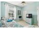 Light and airy bedroom with double bed and built-in TV at 1687 Starling Drive, Tarpon Springs, FL 34689