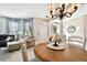 Bright dining room with a wooden table and chairs, overlooking the living room at 1687 Starling Drive, Tarpon Springs, FL 34689