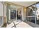 Peaceful screened porch offering a view of the backyard at 1687 Starling Drive, Tarpon Springs, FL 34689