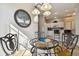 Bright dining area with glass table and kitchen view at 1687 Starling Drive, Tarpon Springs, FL 34689