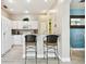 Kitchen with breakfast bar and two bar stools at 1687 Starling Drive, Tarpon Springs, FL 34689