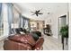 Comfortable living room with leather seating and an open floor plan at 1687 Starling Drive, Tarpon Springs, FL 34689