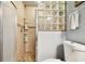 Small bathroom with a shower and toilet at 1687 Starling Drive, Tarpon Springs, FL 34689