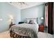 Cozy bedroom with a comfortable bed and nightstands at 1687 Starling Drive, Tarpon Springs, FL 34689