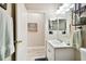 Clean bathroom with single sink vanity and mirror at 1687 Starling Drive, Tarpon Springs, FL 34689