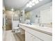 Clean bathroom, featuring a walk-in shower, toilet and updated vanity at 1687 Starling Drive, Tarpon Springs, FL 34689