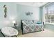 Guest bedroom with daybed, window, and coastal decor at 1687 Starling Drive, Tarpon Springs, FL 34689