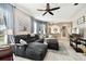 Relaxing living room, featuring a sectional sofa and a ceiling fan at 1687 Starling Drive, Tarpon Springs, FL 34689
