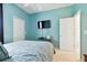 Spacious bedroom with double doors leading to a closet at 1687 Starling Drive, Tarpon Springs, FL 34689