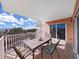 Private balcony with table and chairs, offering an outdoor dining space at 18400 Gulf Blvd # 1302, Indian Shores, FL 33785